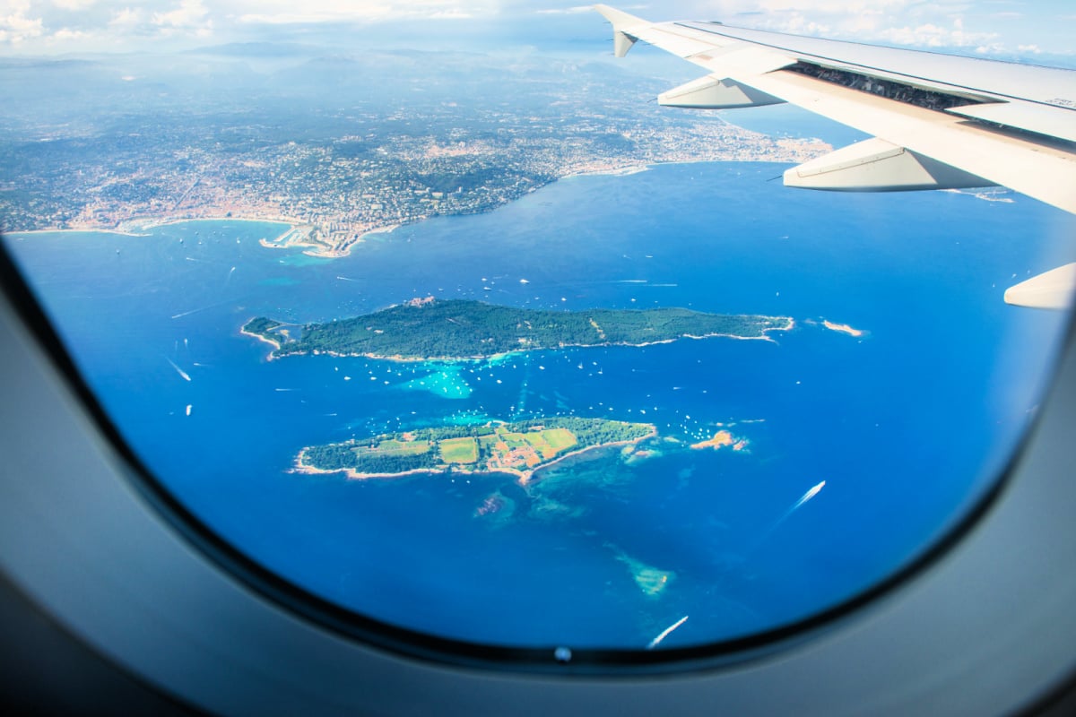 View outside of airplane window to beautiful landscape below